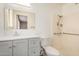 Updated bathroom featuring a modern single sink vanity and accessible walk-in shower with grab bars at 5818 E Colby St, Mesa, AZ 85205
