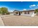 Attractive single-story home with a spacious driveway, low-maintenance landscaping, and a welcoming front entrance at 5818 E Colby St, Mesa, AZ 85205