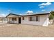 Attractive single-story home with a spacious driveway, low-maintenance landscaping, and a welcoming front entrance at 5818 E Colby St, Mesa, AZ 85205