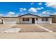 Charming single-story home with a well-maintained front yard and a two-car garage, perfect for suburban living at 5818 E Colby St, Mesa, AZ 85205