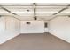 Spacious garage with white walls, epoxy flooring, and unique breeze block window at 5818 E Colby St, Mesa, AZ 85205