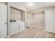 Well-equipped laundry room offering a washer, dryer, ample storage and modern flooring at 5818 E Colby St, Mesa, AZ 85205