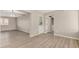 Open-concept living space featuring modern flooring and neutral walls and a laundry room at 5818 E Colby St, Mesa, AZ 85205