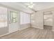 Sunroom with door and window, neutral walls and flooring and a ceiling fan at 5818 E Colby St, Mesa, AZ 85205