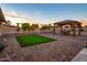 Enjoy outdoor living with this backyard's putting green, gazebo, and well-manicured landscaping at 5922 W Michelle Dr, Glendale, AZ 85308