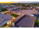 Aerial view of the backyard with covered patio, palm trees, and extensive parking space at 5922 W Michelle Dr, Glendale, AZ 85308