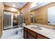 Bathroom featuring vintage wallpaper, a marble vanity, and shower with glass doors at 5922 W Michelle Dr, Glendale, AZ 85308