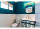This stylish bathroom boasts a distinctive vanity and modern lighting for a unique and luxurious feel at 5922 W Michelle Dr, Glendale, AZ 85308