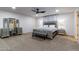 Spacious bedroom showcasing a large bed, mirrored dresser, and a comfortable carpeted floor at 5922 W Michelle Dr, Glendale, AZ 85308