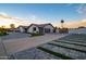Stunning home featuring a three-car garage and decorative driveway and gate at 5922 W Michelle Dr, Glendale, AZ 85308