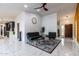 Bright living room featuring modern furniture, ceramic tile floor, and plenty of space at 5922 W Michelle Dr, Glendale, AZ 85308