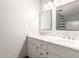 Bright bathroom featuring a double vanity with white marble countertop and two large mirrors at 5926 S Newberry Rd, Tempe, AZ 85283