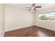 Well-lit bedroom with wood floor and large window overlooking the property at 5926 S Newberry Rd, Tempe, AZ 85283