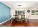 Cozy dining room with stylish light fixture and hardwood flooring at 5926 S Newberry Rd, Tempe, AZ 85283
