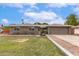 Charming single-story home with a well-manicured lawn and a neutral color palette at 5926 S Newberry Rd, Tempe, AZ 85283