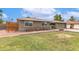 Inviting home with a brick facade, neutral color palette, and mature landscaping at 5926 S Newberry Rd, Tempe, AZ 85283