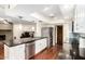 Modern kitchen featuring dark countertops, stainless steel appliances, and wood flooring at 5926 S Newberry Rd, Tempe, AZ 85283