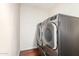 Convenient laundry room featuring modern, stainless steel, front-loading washer and dryer at 5926 S Newberry Rd, Tempe, AZ 85283