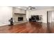 Hardwood floor living room with brick fireplace and ample space at 5926 S Newberry Rd, Tempe, AZ 85283