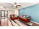 Inviting living room featuring hardwood floors, ceiling fan, and comfortable leather sofas at 5926 S Newberry Rd, Tempe, AZ 85283