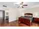 Comfortable main bedroom with wood floors and ensuite bathroom featuring double sinks at 5926 S Newberry Rd, Tempe, AZ 85283