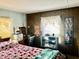 Bedroom with wood-paneled walls, dresser, and mirror at 5933 E Main St # 114, Mesa, AZ 85206