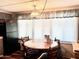 Dining area includes wood table and chairs near window at 5933 E Main St # 114, Mesa, AZ 85206