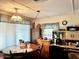 This dining area features a wood table with four chairs and ample natural light at 5933 E Main St # 114, Mesa, AZ 85206