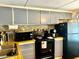 Kitchen boasts gray cabinets, stainless steel appliances, and colorful backsplash at 5933 E Main St # 114, Mesa, AZ 85206