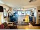 Comfortable living room with sofa, end tables, and a view into the kitchen at 5933 E Main St # 114, Mesa, AZ 85206