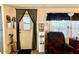 Functional living area with a practical entrance, comfortable seating, and essential amenities at 5933 E Main St # 114, Mesa, AZ 85206