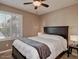 Cozy bedroom with a queen-sized bed, ceiling fan and plantation shutters at 5995 N 78Th St # 1047, Scottsdale, AZ 85250
