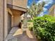 Charming front entrance with column detail and lush landscaping at 5995 N 78Th St # 1047, Scottsdale, AZ 85250