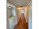Hallway view with wood floors, with rooms leading to carpeted areas, with natural light at 5995 N 78Th St # 1047, Scottsdale, AZ 85250