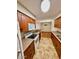 Bright kitchen with wood cabinets, white appliances, and a connecting dining area at 5995 N 78Th St # 1047, Scottsdale, AZ 85250