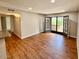 Spacious living area featuring wood flooring and sliding glass doors to the outside at 5995 N 78Th St # 1047, Scottsdale, AZ 85250