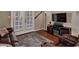 Cozy living room featuring a decorative fireplace, comfortable seating, and French doors at 5995 N 78Th St # 1047, Scottsdale, AZ 85250