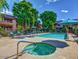 Community pool and spa with lounge chairs and well-maintained landscaping at 5995 N 78Th St # 1047, Scottsdale, AZ 85250