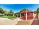 View of a gazebo and concrete walkway in the backyard at 6601 W Montego Ln, Glendale, AZ 85306