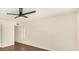 Bright and airy bedroom with a modern ceiling fan and a minimalist aesthetic at 6601 W Montego Ln, Glendale, AZ 85306