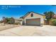 View of a home with a two-car garage, desert landscaping and walkway at 6601 W Montego Ln, Glendale, AZ 85306