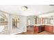 Bright kitchen with hardwood floors, marble countertops, and large windows overlooking backyard at 6601 W Montego Ln, Glendale, AZ 85306