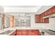 Well-lit kitchen featuring brown cabinets, marble countertops and backsplash, and stainless steel appliances at 6601 W Montego Ln, Glendale, AZ 85306