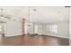 Large, open living room with wood floors, a vaulted ceiling, and recessed lighting at 6601 W Montego Ln, Glendale, AZ 85306