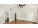 Spacious bedroom with hardwood floors, walk-in closet, and French doors at 6601 W Montego Ln, Glendale, AZ 85306