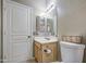 Classic bathroom boasts a toilet, single sink vanity, and mirror at 6811 W Darrel Rd, Laveen, AZ 85339
