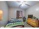 Bedroom includes ceiling fan, carpeting, and a dresser at 6811 W Darrel Rd, Laveen, AZ 85339