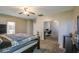 Comfortable bedroom includes a ceiling fan, carpet and views into the office with matching carpet at 6811 W Darrel Rd, Laveen, AZ 85339
