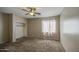 Bedroom featuring a ceiling fan and a closet at 6811 W Darrel Rd, Laveen, AZ 85339