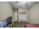 This bedroom features a ceiling fan, closet, and carpeted floor at 6811 W Darrel Rd, Laveen, AZ 85339
